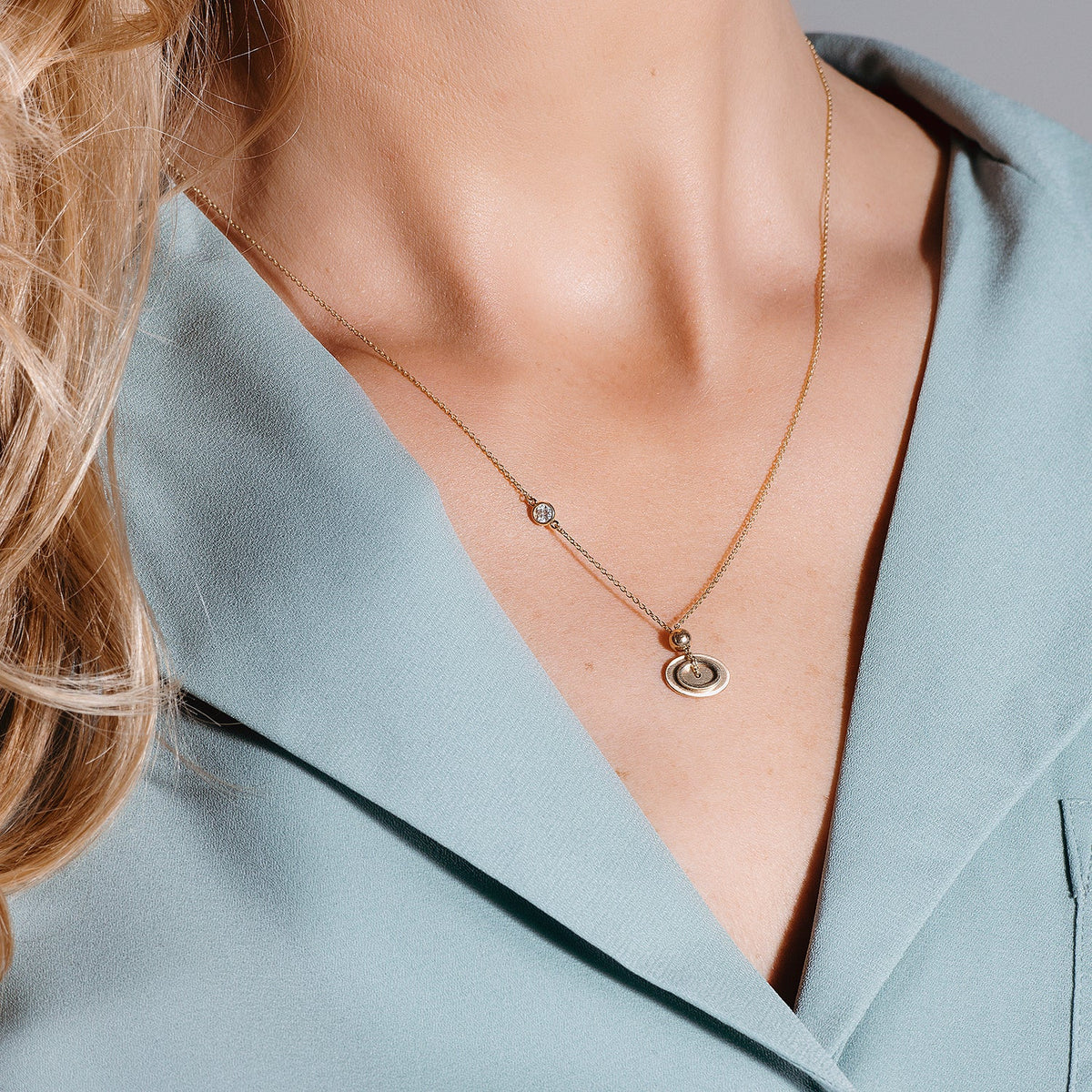 0.10 CTW DEW Moissanite Oval Disc Pendant in 14K Yellow Gold